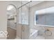 Bright bathroom featuring a glass enclosed shower, soaker tub, and marble tiled walls at 4248 Stone Lake Dr, Zionsville, IN 46077