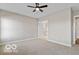 Spacious bedroom with carpet flooring leading into bathroom and walk-in closet at 4248 Stone Lake Dr, Zionsville, IN 46077