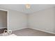 Minimalist bedroom with neutral walls, carpet, and ceiling fixture at 4248 Stone Lake Dr, Zionsville, IN 46077