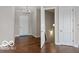 Inviting foyer with hardwood floors, elegant lighting fixture, and a classic white front door at 4248 Stone Lake Dr, Zionsville, IN 46077