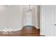 Bright foyer features hardwood floors, a stylish chandelier, and a welcoming front door with a blue rug at 4248 Stone Lake Dr, Zionsville, IN 46077