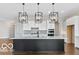 Kitchen island with plenty of lighting and storage in this spacious and modern kitchen at 4248 Stone Lake Dr, Zionsville, IN 46077