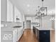 Modern kitchen featuring a large island with seating and pendant lighting at 4248 Stone Lake Dr, Zionsville, IN 46077