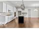 Beautiful open-concept kitchen with white cabinets, stainless appliances, and large center island at 4248 Stone Lake Dr, Zionsville, IN 46077