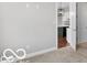 Bright room featuring carpet and a view of kitchen at 4248 Stone Lake Dr, Zionsville, IN 46077