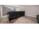 Basement media room with comfortable seating and a large screen TV at 4431 Hickory Stick Row, Greenwood, IN 46143