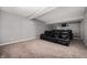Basement media room with comfortable seating perfect for Gathering movie nights at 4431 Hickory Stick Row, Greenwood, IN 46143