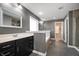 Gray bathroom featuring a double sink vanity, soaking tub, and tiled shower at 4431 Hickory Stick Row, Greenwood, IN 46143