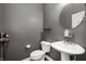 Small bathroom with sink, toilet, and gray painted walls at 4431 Hickory Stick Row, Greenwood, IN 46143