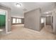 Bonus room features neutral carpeting, three windows, and recessed lighting for ample light at 4431 Hickory Stick Row, Greenwood, IN 46143