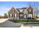 Beautiful two-story brick home featuring well-manicured lawn and professional landscaping at 4431 Hickory Stick Row, Greenwood, IN 46143