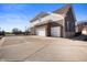 Exterior with three-car garage, brick and siding, and long driveway at 4431 Hickory Stick Row, Greenwood, IN 46143