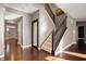 Home foyer with hardwood floors, staircase, natural light and welcoming atmosphere at 4431 Hickory Stick Row, Greenwood, IN 46143