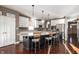 Kitchen featuring a large island with seating, stainless steel appliances, and custom cabinetry at 4431 Hickory Stick Row, Greenwood, IN 46143