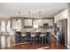 Bright kitchen features a large center island with barstool seating, stainless steel appliances, and modern cabinetry at 4431 Hickory Stick Row, Greenwood, IN 46143
