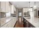 View of the kitchen showcasing a large center island with sink, stainless steel appliances and granite countertops at 4431 Hickory Stick Row, Greenwood, IN 46143