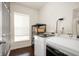 Laundry room with a front load washer and dryer, shelving, and natural light at 4431 Hickory Stick Row, Greenwood, IN 46143