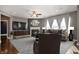 Cozy living room featuring comfortable seating, fireplace, and hardwood floors at 4431 Hickory Stick Row, Greenwood, IN 46143
