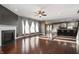 Open-concept living room with hardwood floors, fireplace, and view of kitchen at 4431 Hickory Stick Row, Greenwood, IN 46143