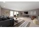Upstairs living room with stylish decor and furnishings including a sectional sofa and modern furniture at 4431 Hickory Stick Row, Greenwood, IN 46143