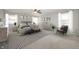 Beautiful main bedroom with serene decor, stylish furniture, and lots of natural light at 4431 Hickory Stick Row, Greenwood, IN 46143