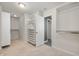 Spacious walk-in closet featuring custom shelving and carpeted floors at 4431 Hickory Stick Row, Greenwood, IN 46143