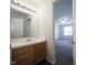 Bathroom with wood vanity, mirror, and view to bedroom at 475 Glenn Villa Ln # 144, Avon, IN 46123