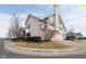 Street view of a townhome featuring two-car garage and brick accents in a residential neighborhood at 475 Glenn Villa Ln # 144, Avon, IN 46123