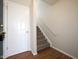 Bright foyer with hardwood floors and a staircase leading to the upper level at 475 Glenn Villa Ln # 144, Avon, IN 46123
