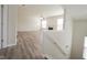 Bright living room featuring wood floors, a fireplace, and a large windows at 475 Glenn Villa Ln # 144, Avon, IN 46123