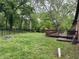 Backyard features a fire pit, green lawn and a private deck at 530 Lansdowne Rd, Indianapolis, IN 46234