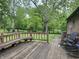 Spacious backyard deck with seating and a view of the lawn at 530 Lansdowne Rd, Indianapolis, IN 46234