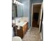 Bathroom boasts new vanity with white countertop and modern fixtures at 530 Lansdowne Rd, Indianapolis, IN 46234