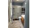 Updated bathroom features a glass enclosed shower and tile floor at 530 Lansdowne Rd, Indianapolis, IN 46234