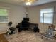 The bedroom is neat with a computer desk and a ceiling fan at 530 Lansdowne Rd, Indianapolis, IN 46234