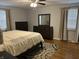 Bedroom with hardwood floors, ceiling fan, and traditional furnishings at 530 Lansdowne Rd, Indianapolis, IN 46234