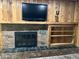 Living room fireplace featuring a brick facade and shelving at 530 Lansdowne Rd, Indianapolis, IN 46234
