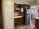 Kitchen featuring built-in shelves and modern appliances at 530 Lansdowne Rd, Indianapolis, IN 46234