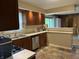 Eat-in kitchen featuring a stainless steel dishwasher and ample counter space at 530 Lansdowne Rd, Indianapolis, IN 46234