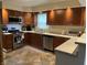 Eat-in kitchen featuring updated appliances, lighting, and floor at 530 Lansdowne Rd, Indianapolis, IN 46234