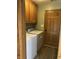 Laundry room featuring washer, dryer, and cabinet storage at 530 Lansdowne Rd, Indianapolis, IN 46234