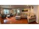 Spacious living room featuring hardwood floors, neutral paint, and a comfortable sectional sofa at 530 Lansdowne Rd, Indianapolis, IN 46234