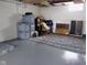 Basement storage area with organized containers and a finished floor at 5317 E 20Th Pl, Indianapolis, IN 46218