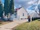 Exterior view of a quaint home, showcasing the lawn and detached garage at 5317 E 20Th Pl, Indianapolis, IN 46218
