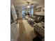 Inviting living room features a large sofa, stylish chairs, modern decor and hardwood flooring at 5317 E 20Th Pl, Indianapolis, IN 46218