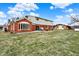 Backyard features a grass area, patio, and a view of the house at 5549 Hollister Dr, Indianapolis, IN 46224