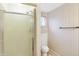 Bathroom featuring a shower, toilet, sink, cabinet, light fixture, and floral wallpaper at 5549 Hollister Dr, Indianapolis, IN 46224
