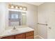 Bathroom featuring a sink, cabinet, light fixture, mirror, and floral wallpaper at 5549 Hollister Dr, Indianapolis, IN 46224