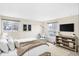 Bright bedroom with natural light, light colored walls, neutral decor, and modern-style furniture at 5549 Hollister Dr, Indianapolis, IN 46224