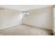 Cozy bedroom features neutral carpet and a window providing natural light at 5549 Hollister Dr, Indianapolis, IN 46224